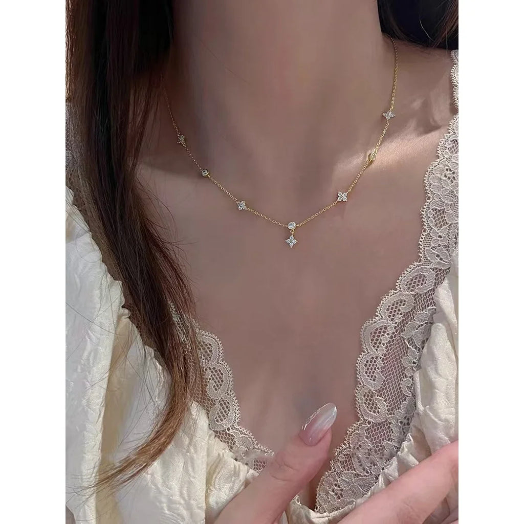 Chic zircon four-leaf clover necklace for women, a minimalist luxury collarbone chain.