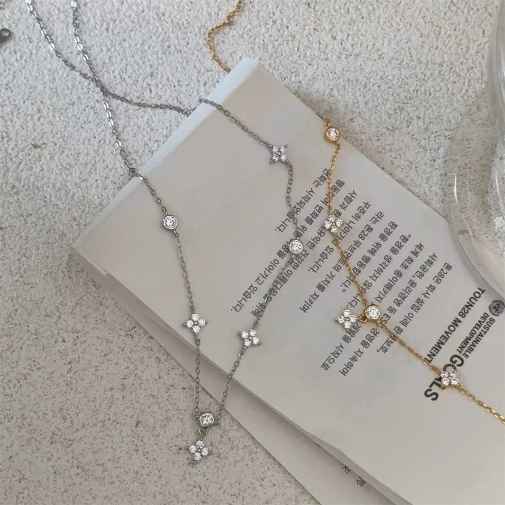 Chic zircon four-leaf clover necklace for women, a minimalist luxury collarbone chain.