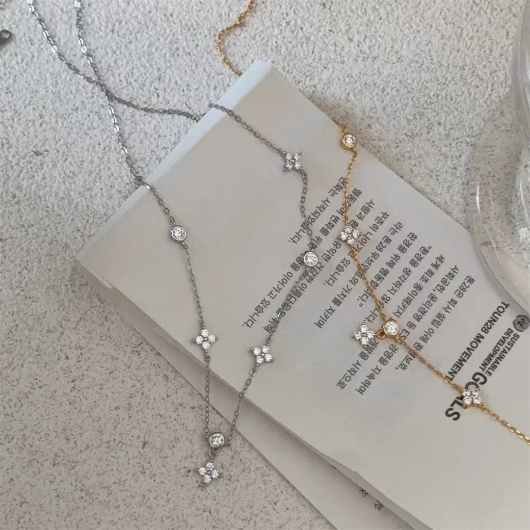 Chic zircon four-leaf clover necklace for women, a minimalist luxury collarbone chain.