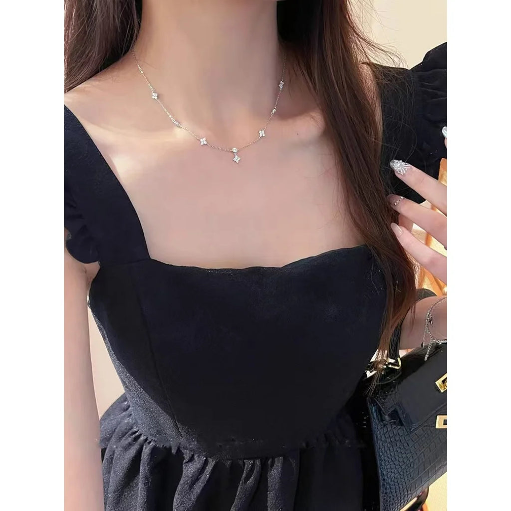 Chic zircon four-leaf clover necklace for women, a minimalist luxury collarbone chain.