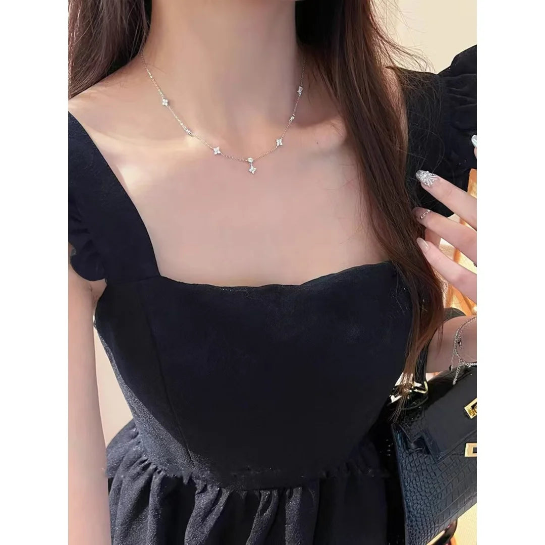 Chic zircon four-leaf clover necklace for women, a minimalist luxury collarbone chain.